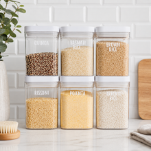 Load image into Gallery viewer, Personalised pantry labels on clear food storage containers filled with quinoa, rice and polenta in organised kitchen pantry