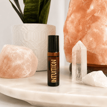 Load image into Gallery viewer, Amber essential oil roller bottles with personalised gold vinyl blend labels.