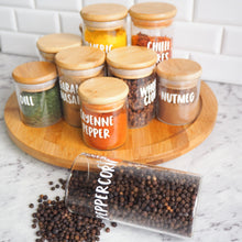 Load image into Gallery viewer, A stylish kitchen countertop featuring custom spice jars labeled with personalized spice names.