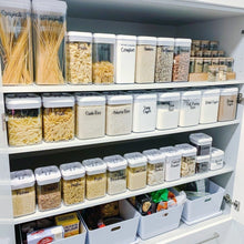 Load image into Gallery viewer, A well-organized pantry displaying various labeled jars filled with spices and ingredients.