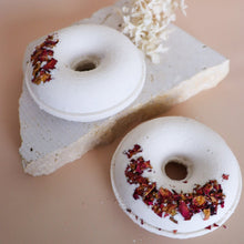 Load image into Gallery viewer, Handmade doughnut bath bomb topped with rose petals, perfect for bath lovers, gift boxes and relaxing self-care.