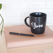 Load image into Gallery viewer, Waterproof personalised name labels featured on a mug for a unique custom gift