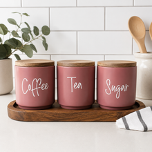 Load image into Gallery viewer, Modern pink kitchen canisters featuring custom tea coffee and sugar labels for an organised stylish look
