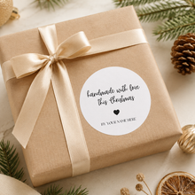 Load image into Gallery viewer, Personalised handmade with love Christmas sticker on kraft wrapped gift with neutral ribbon and festive decor.
