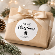 Load image into Gallery viewer, Modern Merry Christmas personalised sticker on kraft wrapped gift with neutral ribbon and festive decor.
