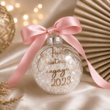 Load image into Gallery viewer, Personalised filled Christmas bauble with custom vinyl name and iridescent tinsel filler, finished with pink satin ribbon.
