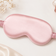 Load image into Gallery viewer, Blush pink satin eye mask styled as a pamper gift for bridesmaid proposal bags, bridal party gifts and hen party favours.
