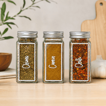 Load image into Gallery viewer, Tall vinyl spice jar labels on rectangular glass spice jars in an organised kitchen pantry.
