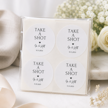 Load image into Gallery viewer, Personalised Take a Shot wedding favour stickers packaged in clear sleeve with neutral wedding styling.

