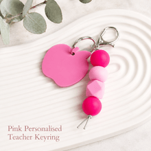 Load image into Gallery viewer, Pink personalised teacher keyring with acrylic apple tag, pink silicone beads and silver hardware.
