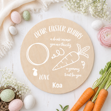 Load image into Gallery viewer, Personalised Dear Easter Bunny wooden treat board with white vinyl text and the name Koa on a soft Easter-themed background.
