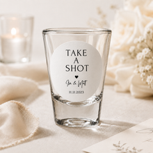 Load image into Gallery viewer, Personalised wedding favour sticker on shot glass with names and wedding date for custom wedding gifts.
