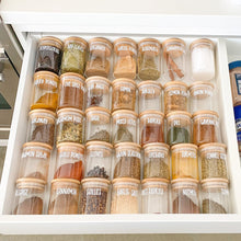Load image into Gallery viewer,  Waterproof vinyl spice labels on glass spice jars displayed in a drawer
